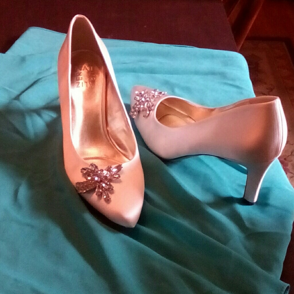 Ivory bejeweled satin pumps